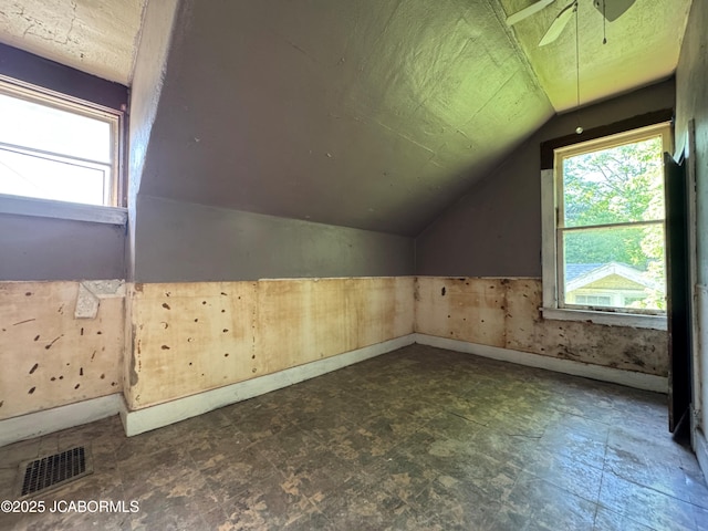 204 Havana St, Jefferson City, MO 65109 - bonus room with lofted ceiling, plenty of natural light, a ceiling fan, and baseboards