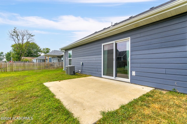 exterior space featuring cooling unit, a patio area, and fence