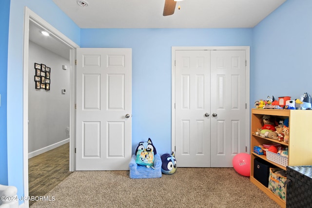 game room with carpet, baseboards, and ceiling fan