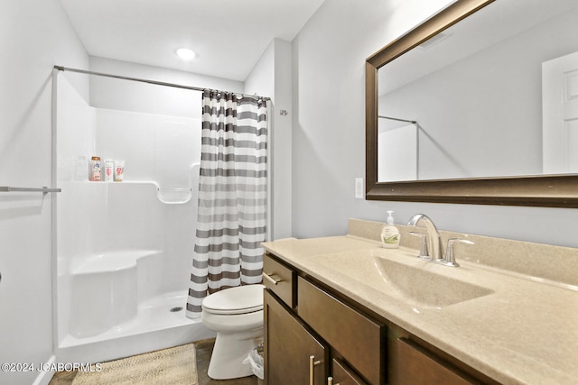 bathroom with visible vents, a shower with shower curtain, vanity, and toilet