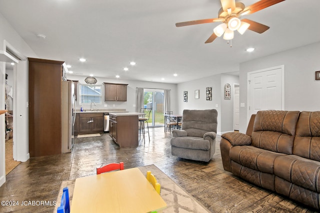 living area featuring recessed lighting, dark wood finished floors, and ceiling fan