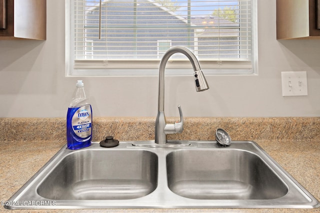 details featuring light countertops and a sink