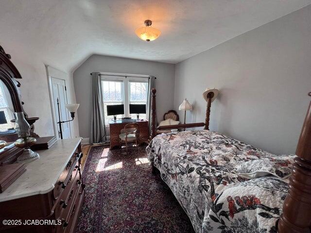 bedroom featuring vaulted ceiling