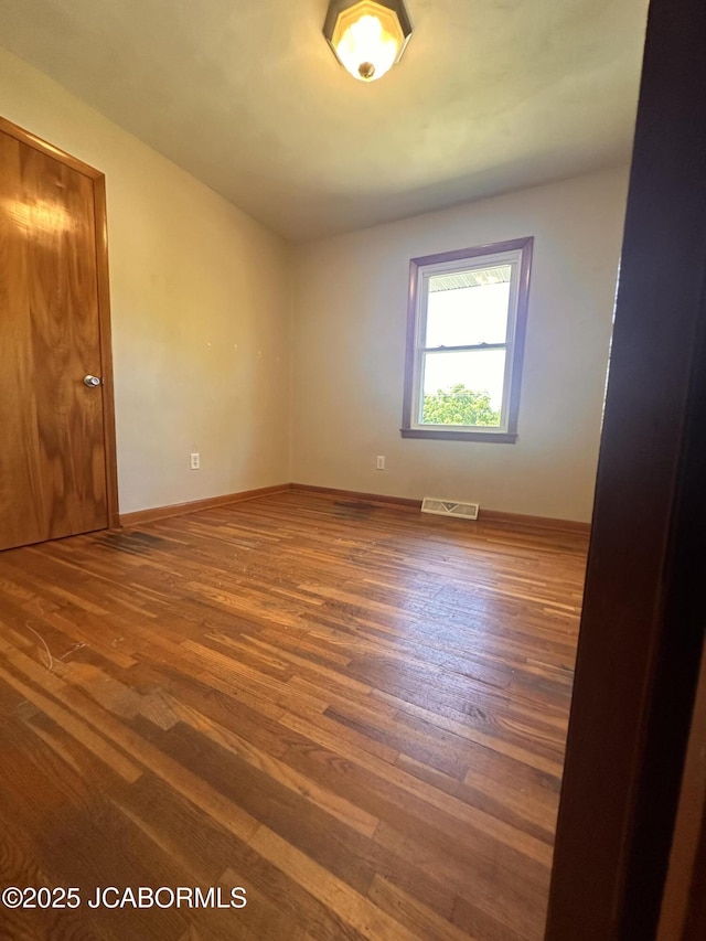 713 Lincoln St, Linn, MO 65051 - empty room with wood finished floors and baseboards