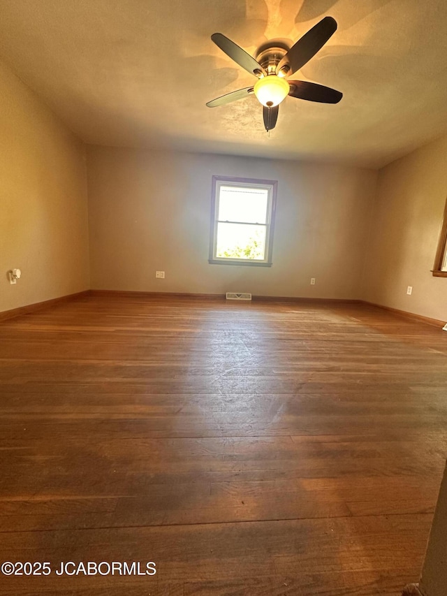 713 Lincoln St, Linn, MO 65051 - unfurnished room featuring wood finished floors, a ceiling fan, and baseboards