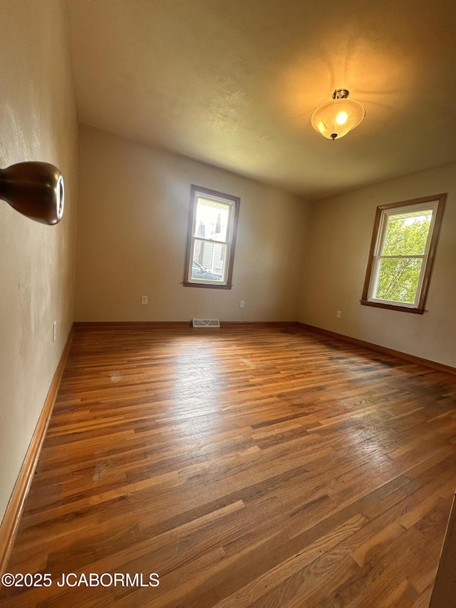 713 Lincoln St, Linn, MO 65051 - unfurnished room featuring wood finished floors and baseboards