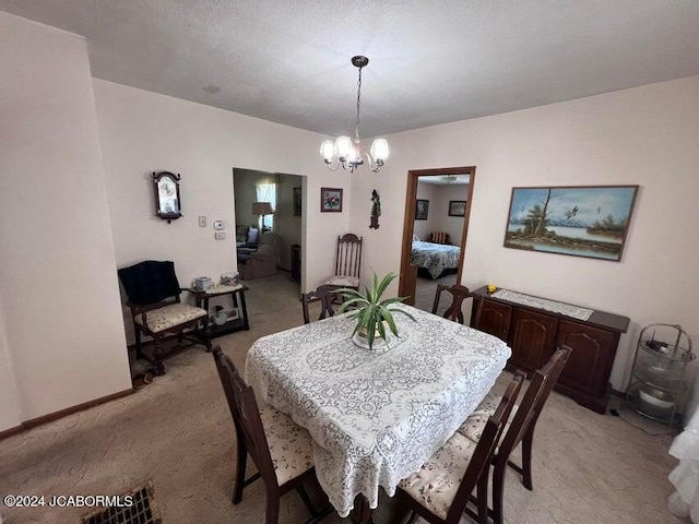 carpeted dining area with a textured ceiling and an inviting chandelier