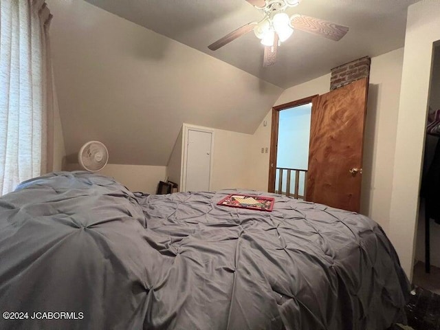 bedroom with ceiling fan and lofted ceiling