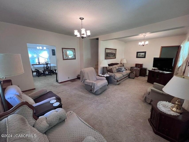 living room with a textured ceiling, light carpet, and an inviting chandelier