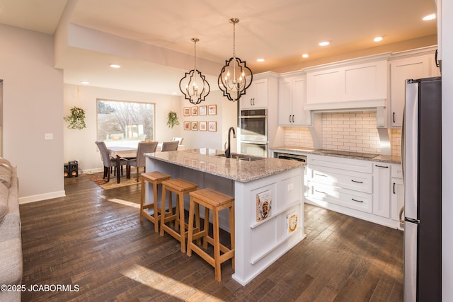 kitchen featuring dark wood-style floors, white cabinetry, and appliances with stainless steel finishes