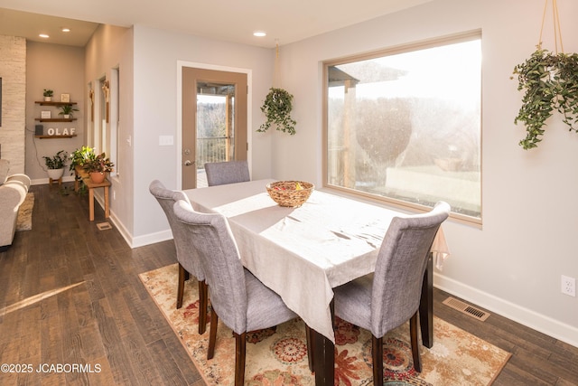 dining space with baseboards, visible vents, dark wood finished floors, and recessed lighting