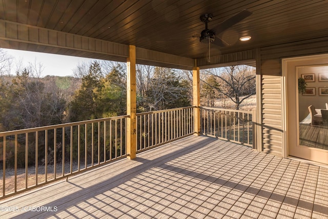 wooden terrace with a ceiling fan