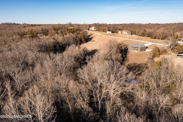 birds eye view of property with a rural view