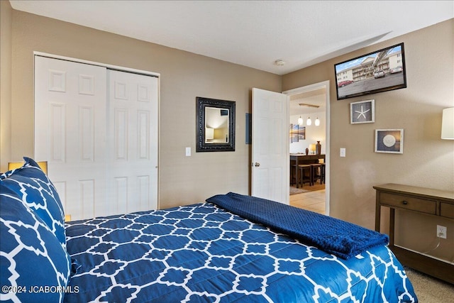 carpeted bedroom featuring a closet