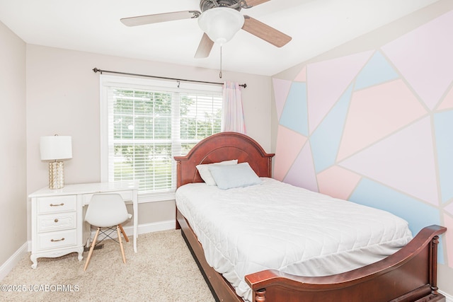 bedroom featuring baseboards, light carpet, and ceiling fan