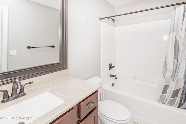 bathroom with toilet, shower / bath combo with shower curtain, and vanity