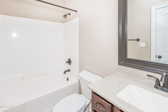 bathroom with vanity, toilet, and bathtub / shower combination