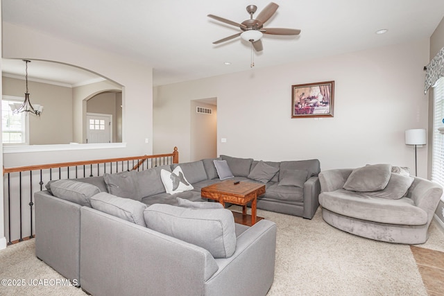 living area with ceiling fan, a chandelier, and recessed lighting