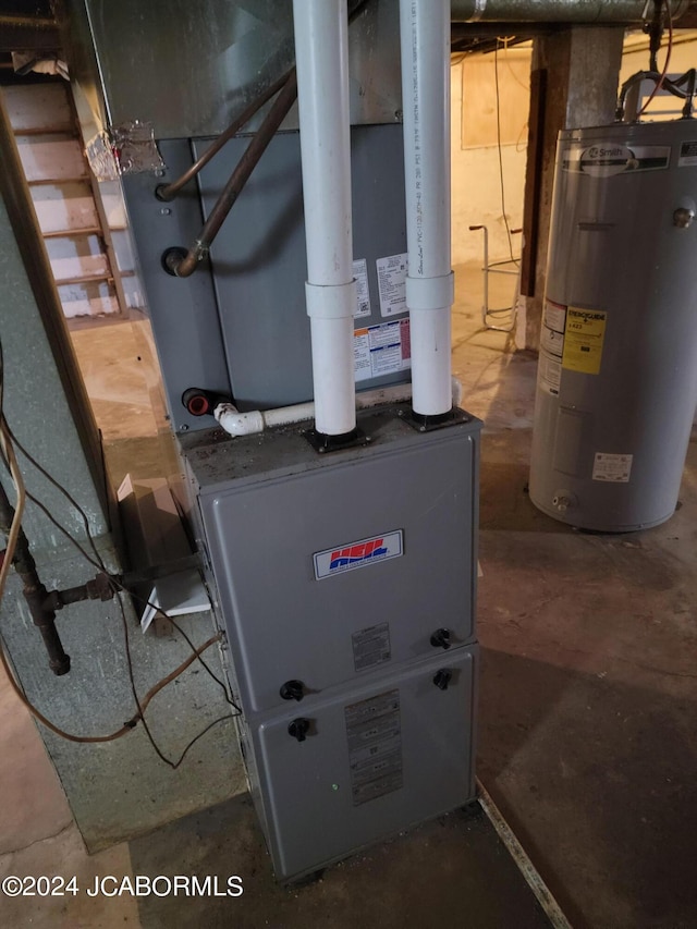 utility room with heating unit and water heater