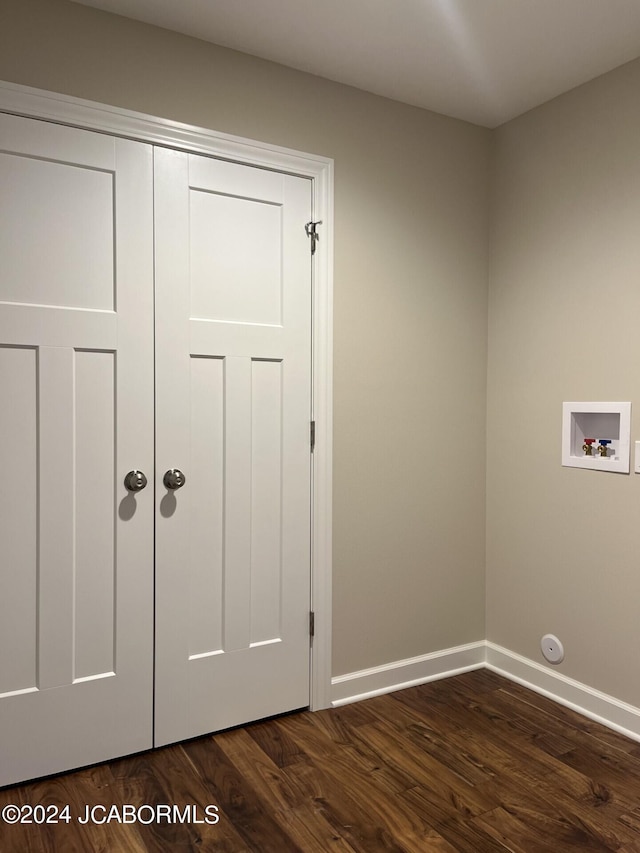 clothes washing area featuring washer hookup and dark hardwood / wood-style floors