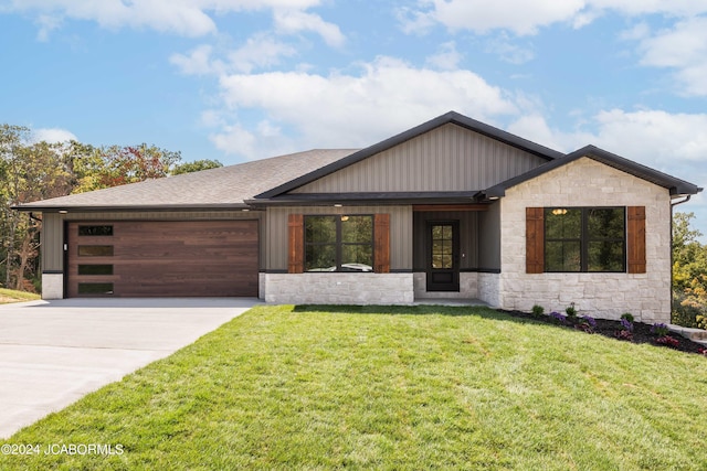 view of front facade with a front lawn and a garage