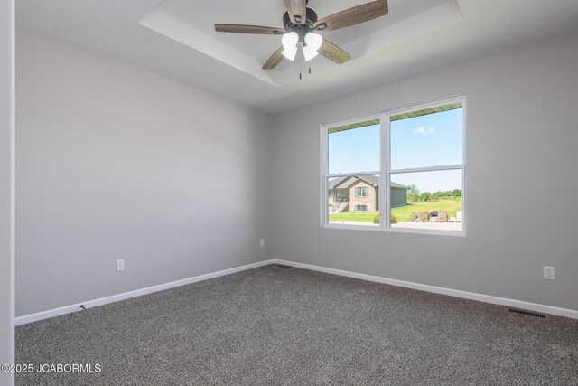 1502 Summerfield Dr, Jefferson City, MO 65109 - carpeted empty room with a raised ceiling, baseboards, and ceiling fan