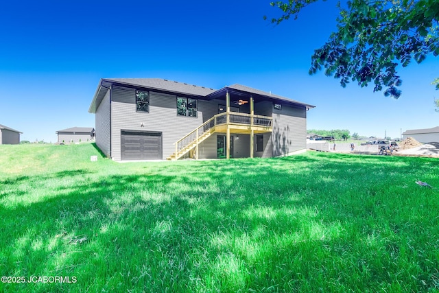 1502 Summerfield Dr, Jefferson City, MO 65109 - back of house featuring a garage, a yard, stairs, and a deck