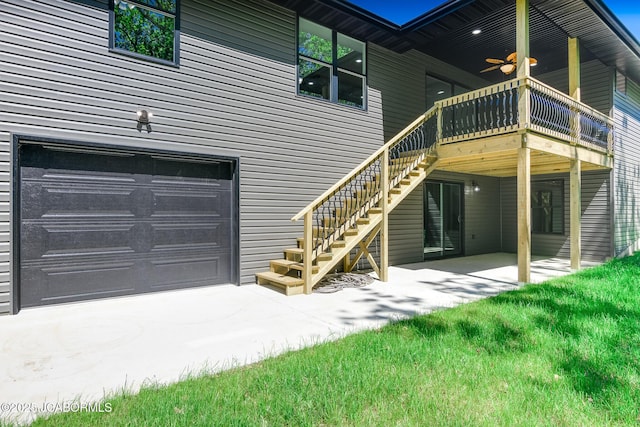 1502 Summerfield Dr, Jefferson City, MO 65109 - rear view of house with a garage, a ceiling fan, concrete driveway, stairway, and a patio area