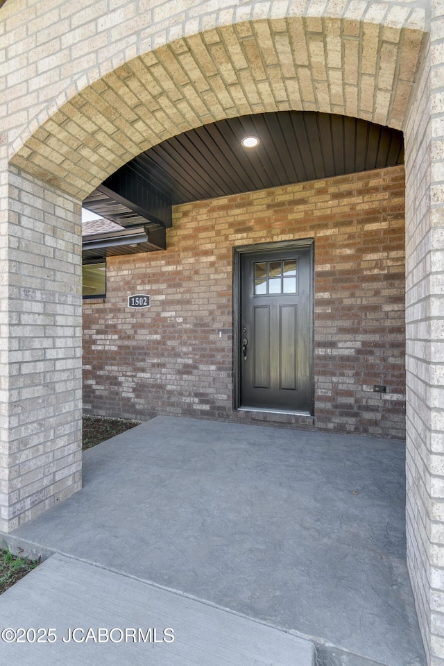 1502 Summerfield Dr, Jefferson City, MO 65109 - entrance to property featuring a patio and brick siding