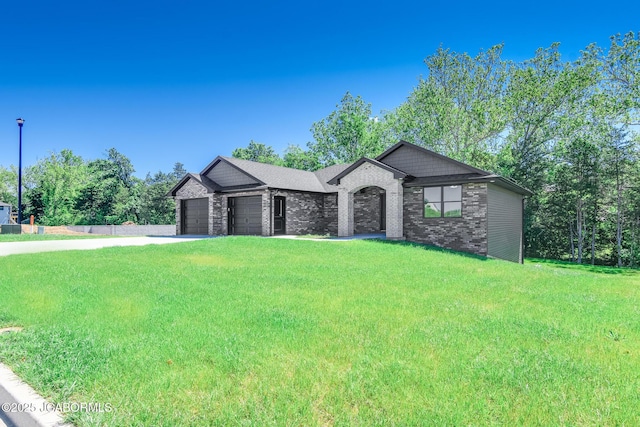 1502 Summerfield Dr, Jefferson City, MO 65109 - view of front facade featuring a garage, concrete driveway, a front lawn, and brick siding