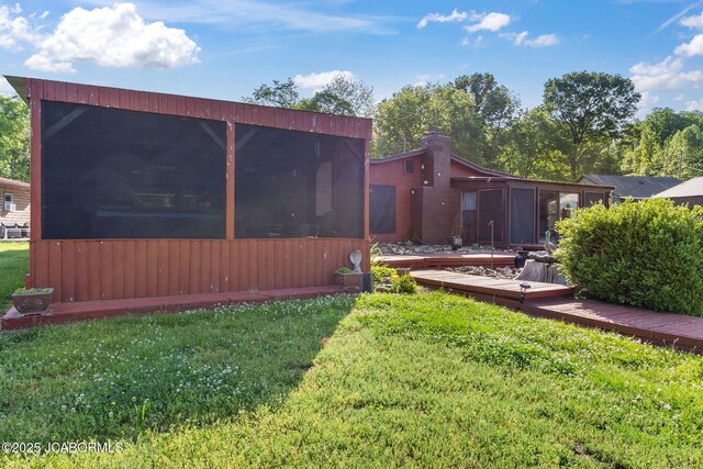 24671 Gardner Rd, Versailles, MO 65084 - view of green lawn with a sunroom