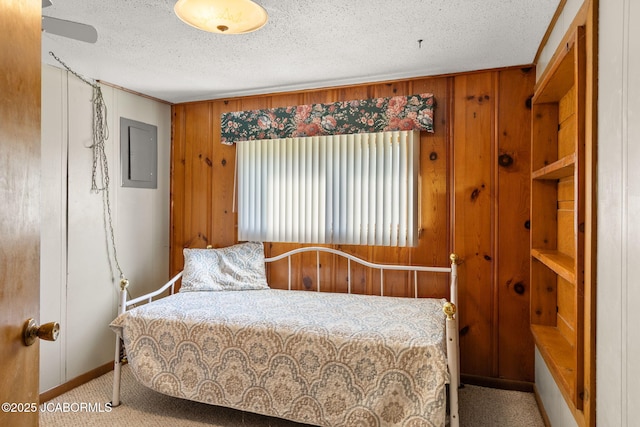 24671 Gardner Rd, Versailles, MO 65084 - bedroom with wooden walls, electric panel, carpet floors, a textured ceiling, and baseboards