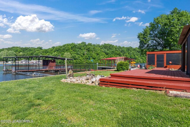 24671 Gardner Rd, Versailles, MO 65084 - view of yard featuring a forest view, a dock, and a deck with water view