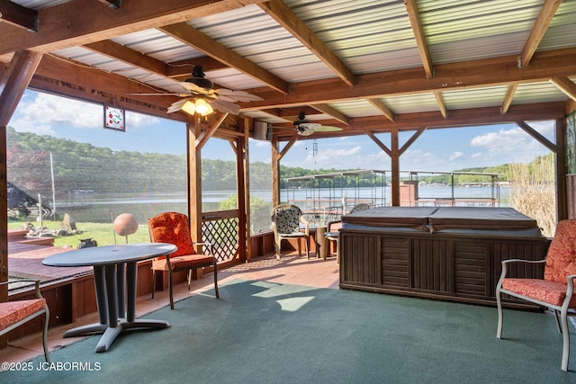 24671 Gardner Rd, Versailles, MO 65084 - view of patio / terrace featuring a hot tub, a ceiling fan, and a water view