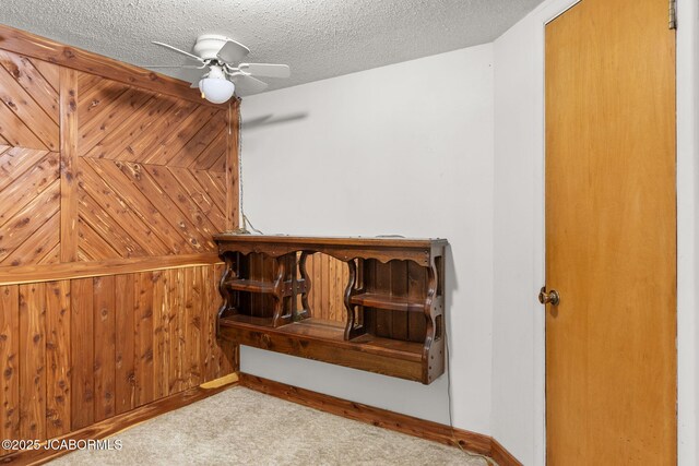 24671 Gardner Rd, Versailles, MO 65084 - unfurnished bedroom with carpet floors, a textured ceiling, a ceiling fan, and baseboards