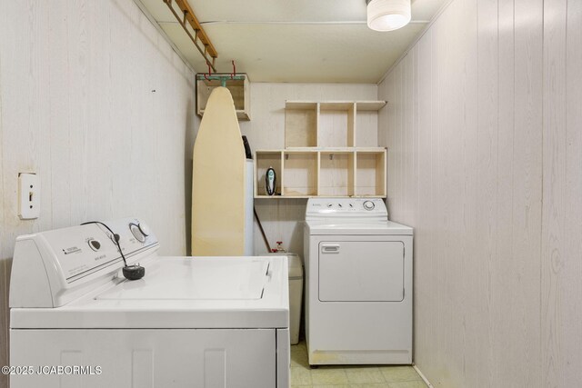 24671 Gardner Rd, Versailles, MO 65084 - washroom with washing machine and dryer and wood walls