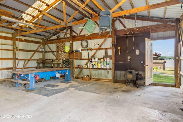 24671 Gardner Rd, Versailles, MO 65084 - garage featuring metal wall and a workshop area