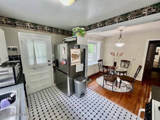 711 Cardinal St, Jefferson City, MO 65101 - kitchen featuring stainless steel fridge with ice dispenser