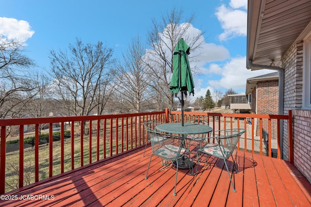 wooden deck with outdoor dining space