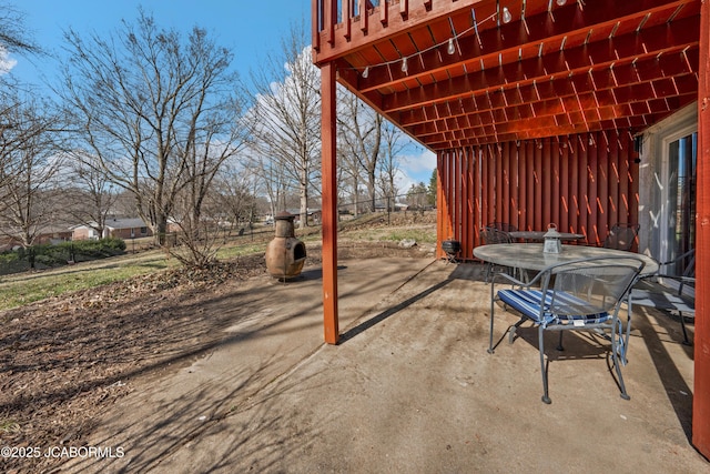 view of patio featuring fence