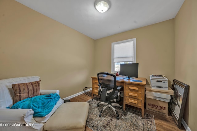 office featuring wood finished floors and baseboards