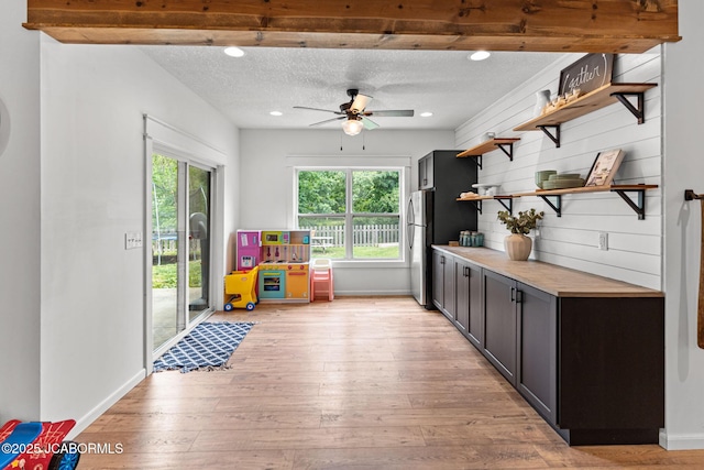 109 Redtail Dr, Ashland, MO 65010 - kitchen with open shelves, freestanding refrigerator, light wood finished floors, a ceiling fan, and a textured ceiling
