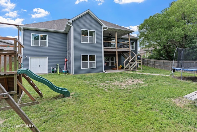 109 Redtail Dr, Ashland, MO 65010 - rear view of house with a trampoline, a playground, stairs, ceiling fan, and a deck