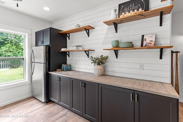 109 Redtail Dr, Ashland, MO 65010 - kitchen featuring open shelves, freestanding refrigerator, light wood-style floors, light stone countertops, and recessed lighting