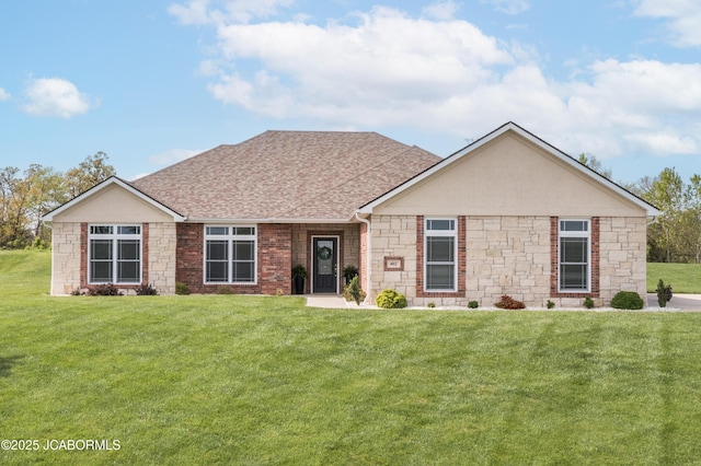 ranch-style house featuring stone siding, a shingled roof, and a front yard