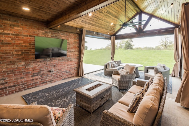 view of patio featuring an outdoor living space with a fire pit and a ceiling fan