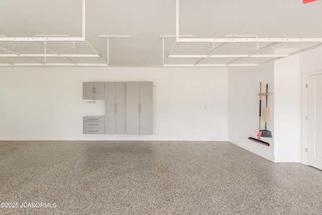 garage featuring baseboards