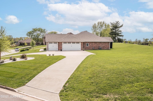 ranch-style home featuring concrete driveway, brick siding, an attached garage, a shingled roof, and a front yard