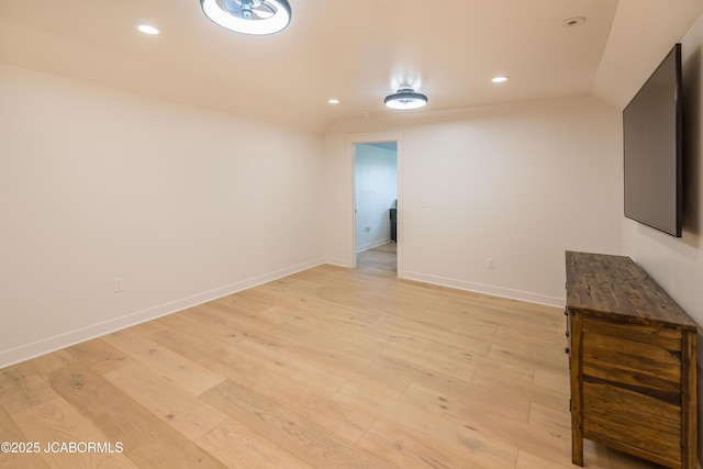 unfurnished living room with recessed lighting and light wood-style flooring