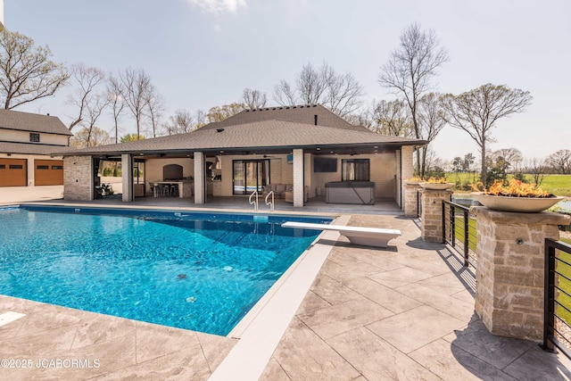 pool featuring outdoor dry bar, a ceiling fan, outdoor lounge area, a diving board, and a patio